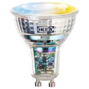Ikea KAJPLATS bulb, clear glass body, colorful spectrum top, metal base.