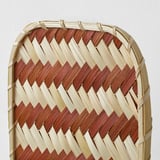 Intricate woven basket, natural tones, zigzag pattern of light and dark wood, handcrafted quality.