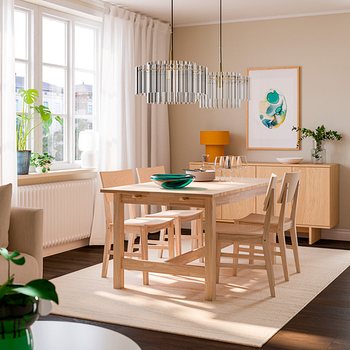Minimalist dining room - light wood table, bench, sideboard, art, plants, large window.