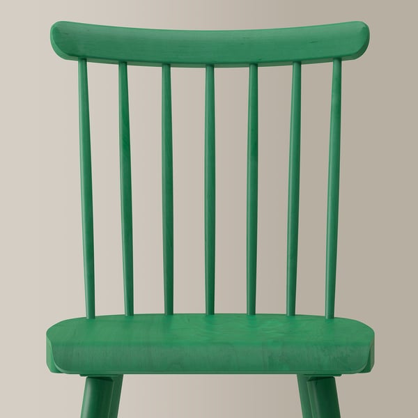 Bright green wooden chair with curved solid backrest and seat, featuring four vertical slats. Sturdy spindle design, perfect for dining.