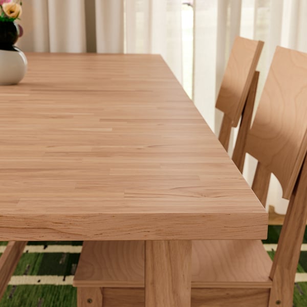 Wooden dining set with smooth table and sturdy chairs.