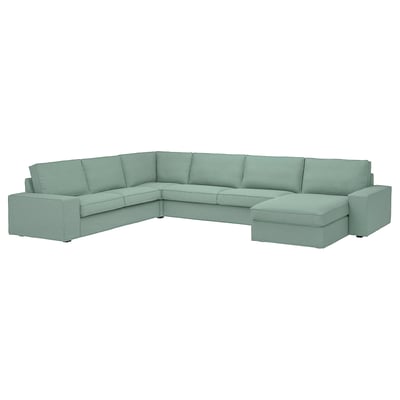 Light green KIVIK sectional sofa with low armrests and deep cushions, designed for comfort and relaxation.