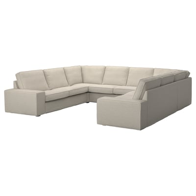 Large l-shaped sectional sofa in light grey fabric with boxy cushions. Modern and minimalistic design, perfect for spacious living areas.
