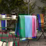 KLIBBKORSÖRT throw on chair, green/blue stripes, soft fleece.