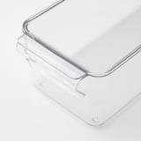 Clear, durable plastic storage box with built-in handle and lid, designed for fridge organization.