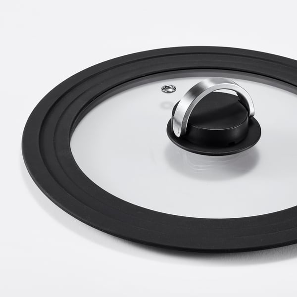 Round glass pot lid with black silicone rim, stainless handle.
