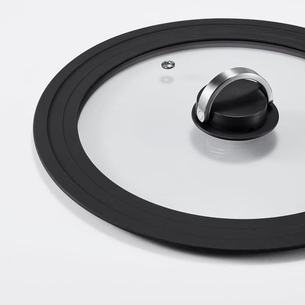 High-quality glass lid with black silicone rim, metal handle, and small vent for steam release.