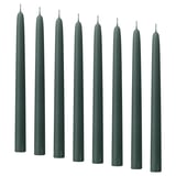 Dark green KLOKHET candles in a row, tall and straight, made of stearin with cotton wicks.