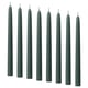 Dark green KLOKHET candles in a row, tall and straight, made of stearin with cotton wicks.