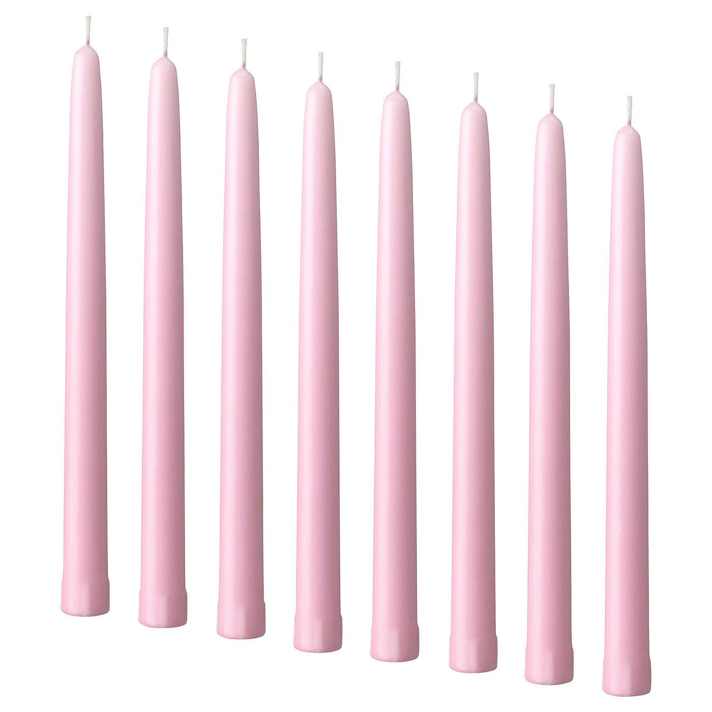 Nine pale pink KLOKHET candles in a row, cylindrical shape, made of stearin.