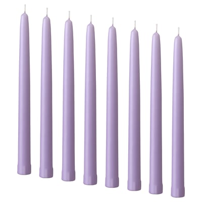 Eight purple candles in a row, uniformly shaped with tapered tips and wrapped bases, standing upright.