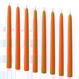 Eight tall orange candles in a line. Stearin material, unlit with cotton wicks.