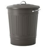 A KNODD grey metal bin with vertical grooves. It has a lid with a handle and a hook for hanging.