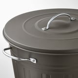 Close-up of a large grey metal bin with sturdy handles and a securely locking lid.