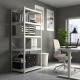 Modern home office with KNODD steel storage bin, desk, chair, and plant.