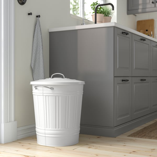 Large white KNODD bin in kitchen, steel, tall with handles and lid hook.