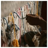 Crafting colorful KNYLHAVRE rug on loom