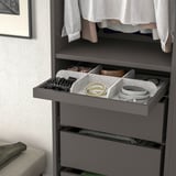 Open wardrobe organizer with felt dividers for jewelry, accessories, and small items.