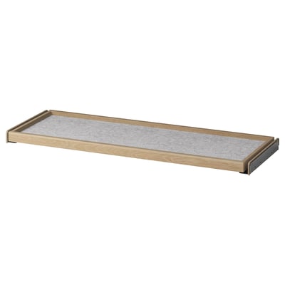 Wooden pull-out tray with natural finish and grey mat, ideal for wardrobe storage.