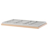 An ikea KOMPLEMENT organizer tray in white with a wooden front, designed for storing accessories.