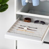 White drawer organizer tray with felt lining, compartments for watches, and sunglasses. Soft close function visible.