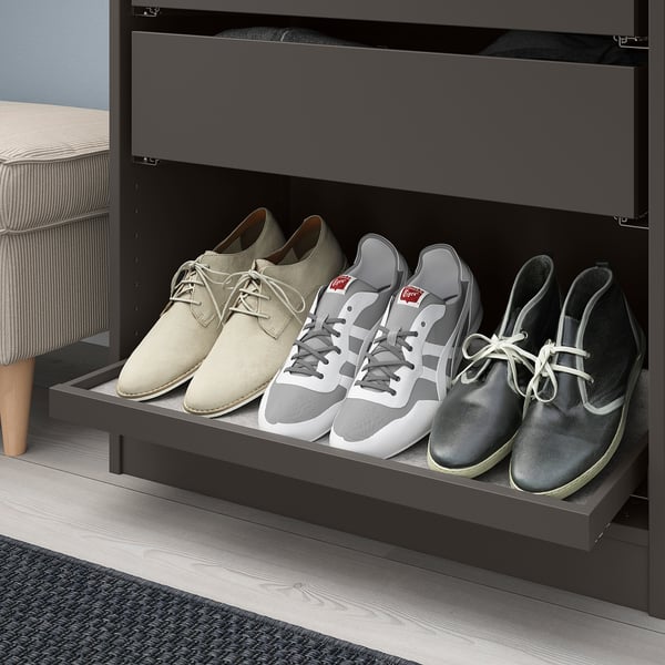 Pull-out shoe organizer with felt-lined compartments.