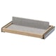 IKEA KOMPLEMENT pull-out tray in light beige wood with gray felt liner, rectangular shape. Modern design, ideal for organizing accessories.
