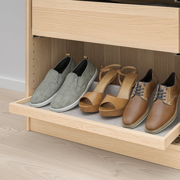 Wooden shoe rack with felt lining holds four pairs of shoes neatly. The grey and tan shoes are shown in a closet drawer, easy to access and organized.