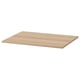 An ikea KOMPLEMENT shelf in oak effect. Its rectangular, flat, and made of particleboard with a paper foil finish.