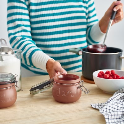 Filling KORKEN jar with homemade jam.