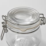 Clear glass jar with secure metal clasp lid, sealed rubber ring ensuring airtight closure.
