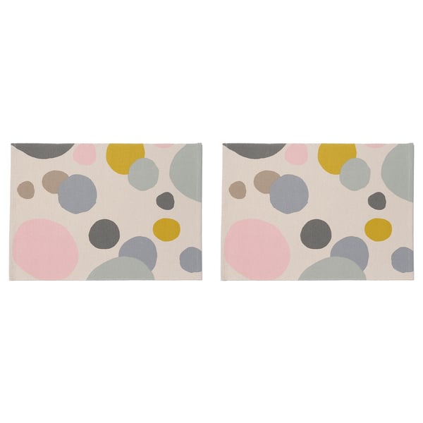Two rectangular place mats with multicolored abstract circles.
