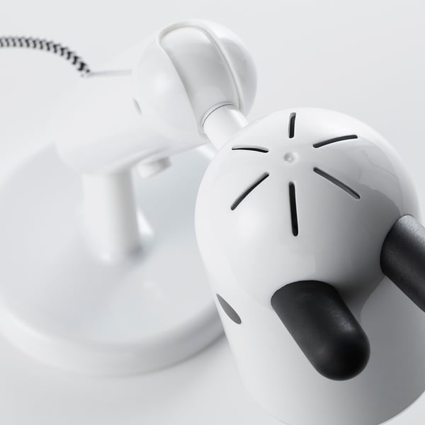 Close-up of a well-designed, adjustable lamp with a smooth, white surface and dark gray ears and base, showcasing its robust and durable construction.