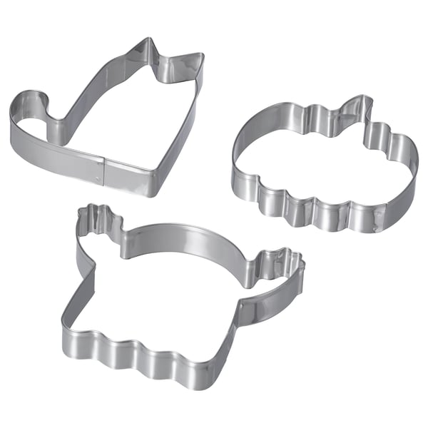 Three stainless steel cookie cutters in shapes of a house, a cloud, and an abstract design. Silver, used for making fun-shaped cookies or pastries.