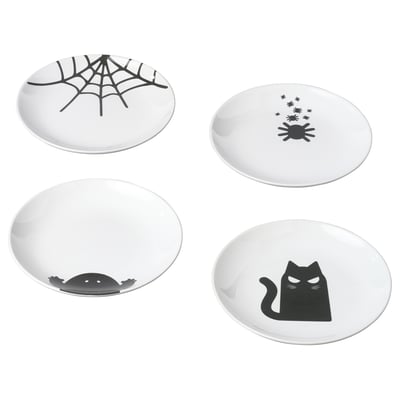 Four white KUSTFYR plates, each with black halloween-themed designs in different positions. Made of stoneware.