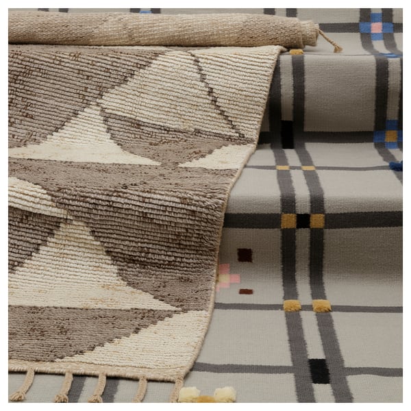 This image shows KVASTGRÄS rugs in neutral colors featuring geometric patterns. The rugs are hand-knotted with wool, cotton, and have braided fringes.