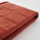 Folded rust-colored fabric, soft texture, likely LÄKTARE cover.