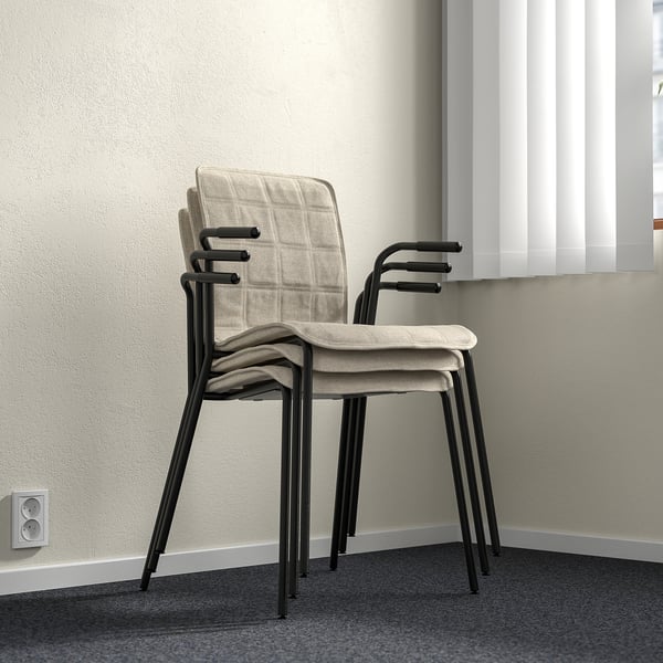 Stackable conference chair with removable cover, lumbar support, and armrests.