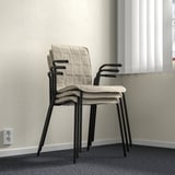 Stackable conference chair with removable cover, lumbar support, and armrests.