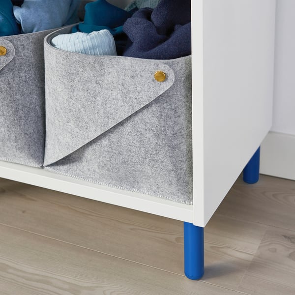 Storage baskets with adjustable blue legs for platsa system, raising items for easy cleaning.