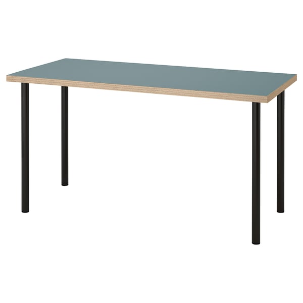 A blue LAGKAPTEN desk with black metal legs. The tabletop has a sleek edge and a honeycomb paper filling.