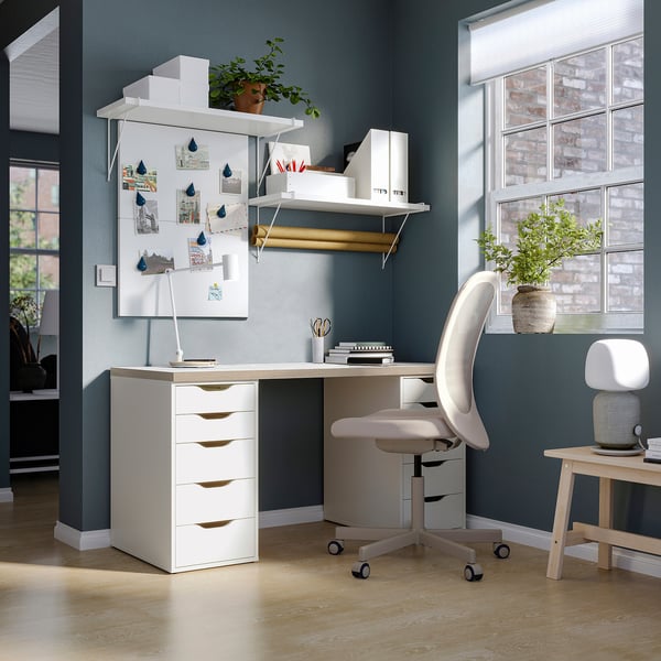 Modern home office with white LAGKAPTEN desk, chair, and shelves. Bright, minimalist design.