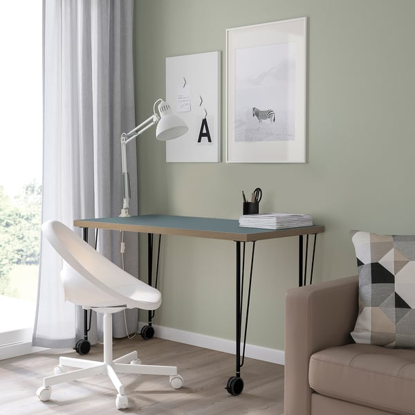 Ground-floor workspace: LAGKAPTEN desk, blue, modern, chair, lamp, art, window.