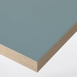 Stack of sleek, light blue desk tops; clean, smooth surfaces, quality edge finish.