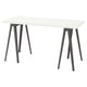 LAGKAPTEN: modern white desk with angular black legs, minimalist design.