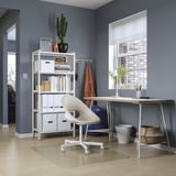 Gray home office with LAGKAPTEN desk, white chair, books, cactus, decor.