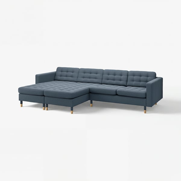 Modern blue sectional sofa with square cushions and wooden legs.