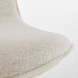 Close-up of LÅNGFJÄLL chairs upholstered seat, showcasing soft, textured fabric and neat stitching, emphasizing comfort and quality.