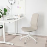 Modern home office scene with LÅNGFJÄLL chair in light beige, matching white desk, and minimalist decor.