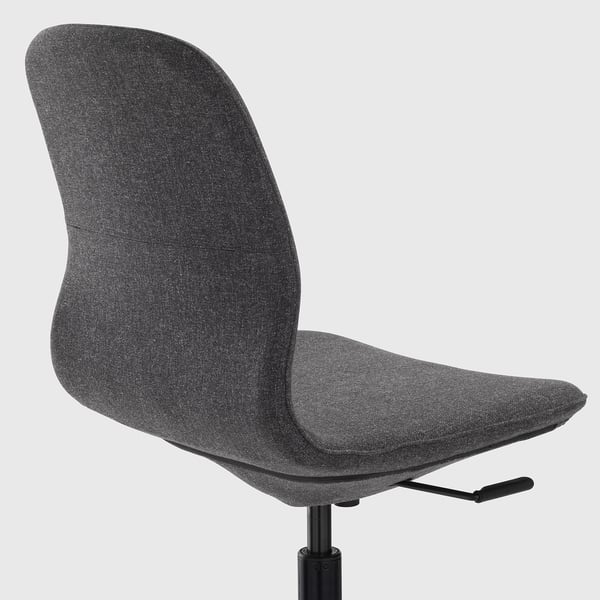 Dark grey office chair with height-adjustable seat, lumbar support, and tilt function. Tilt mechanism visible.